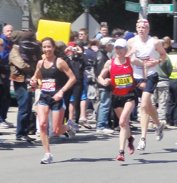 Former Falmouth resident Kara Waters runs alongside Joan Benoit Samuelson at the Boston Marathon on Monday. Waters, who now lives in Baltimore, said a friend took the photo at mile 17. "I was so thrilled to see her," said Waters, who remembers attending one of Benoit's running camps as a 7th grader. "She smiled and said, 'You are doing such a great time. Go get it.' Needless to say, she passed me at mile 18, but what an inspiration!" Happy to share more and kind of a once in a life-time photo op considering she hasn't run the marathon in years and heard there were a number of news segments about her running the marathon this year.