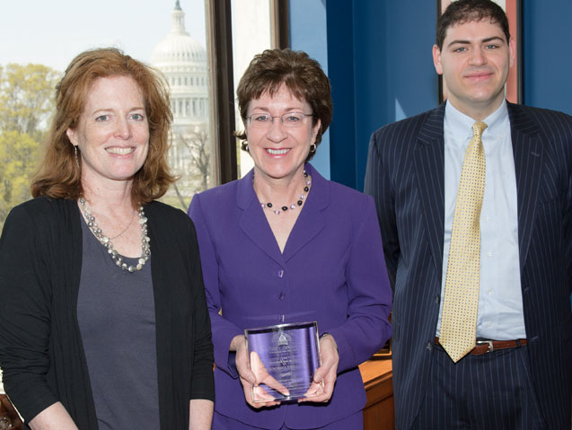 U.S. Sen. Susan Collins, center, accepts the Champion of Children Award at the Capital on Monday from Morna Murray, left, and Jared Solomon, executives at First Focus, a bipartisan advocacy group for children's issues.