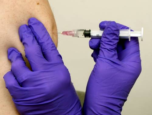 A student at Freeport High School gets a flu shot.