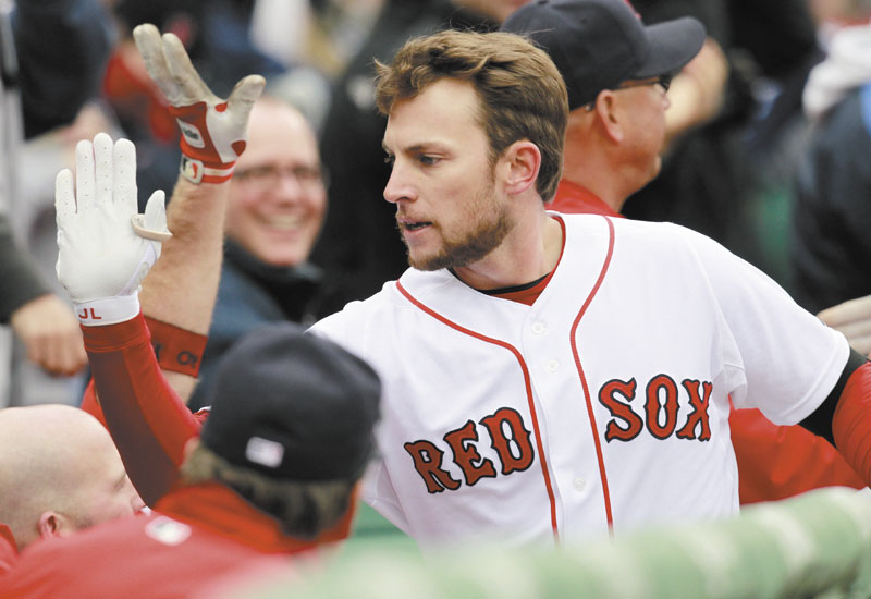 Boston Red Sox shortstop Jed Lowrie celebrates after hitting a two-run home run in the second inning of the Red Sox’ 4-1 win over the Toronto Blue Jays on Saturday at Fenway Park in Boston.