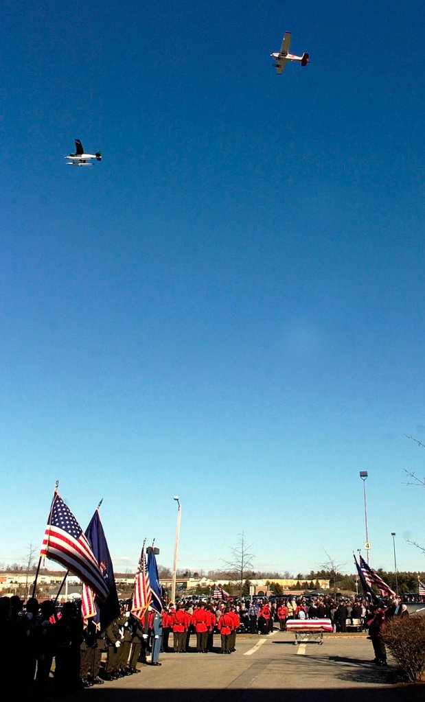 Two of the four planes in a missing man formation fly over the Augusta Civic Center at the end of the celebration of life for Game Warden Pilot Daryl Gordon on March 30. More than 600 officers from several agencies gathered to honor Gordon, who died in a plane crash on March 24.