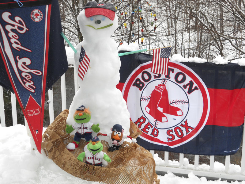 Red Sox fans Ed and Diane Stone of Kennebunk made good use of the unseasonable weather to create this tableau in honor of Boston’s season opener Friday.