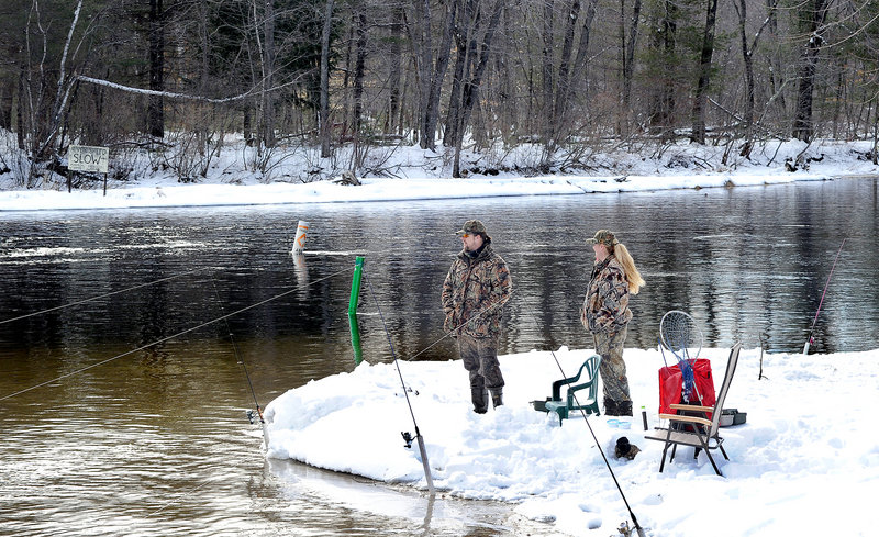 Steve Bickford and Lorri Nelson of Standish try their luck on April 2 at the Songo Locks in Naples. Many anglers are unaware they can fish in fresh water year-round in much of southern and eastern Maine.