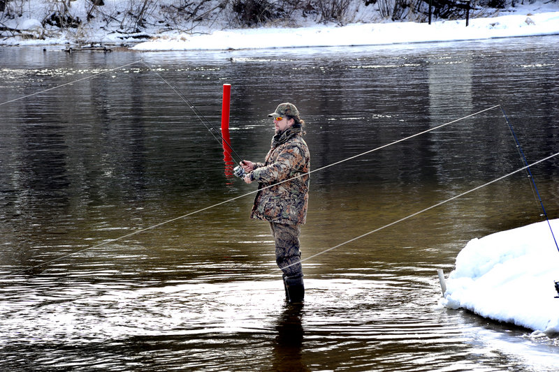 Steve Bickford of Standish, fishing at the Songo Locks earlier this month, says he doesn’t understand why the new year-round fishing rules only apply to ponds and lakes.