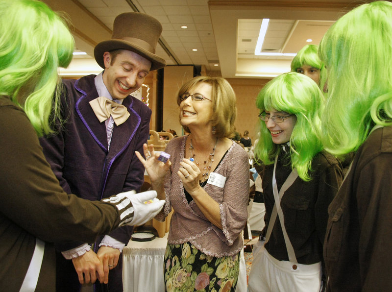 Kim Block of WGME-TV, center, enjoys a visit with Willy Wonka, aka Greg Caiazzo, at the Chocolate Lovers’ Fling.