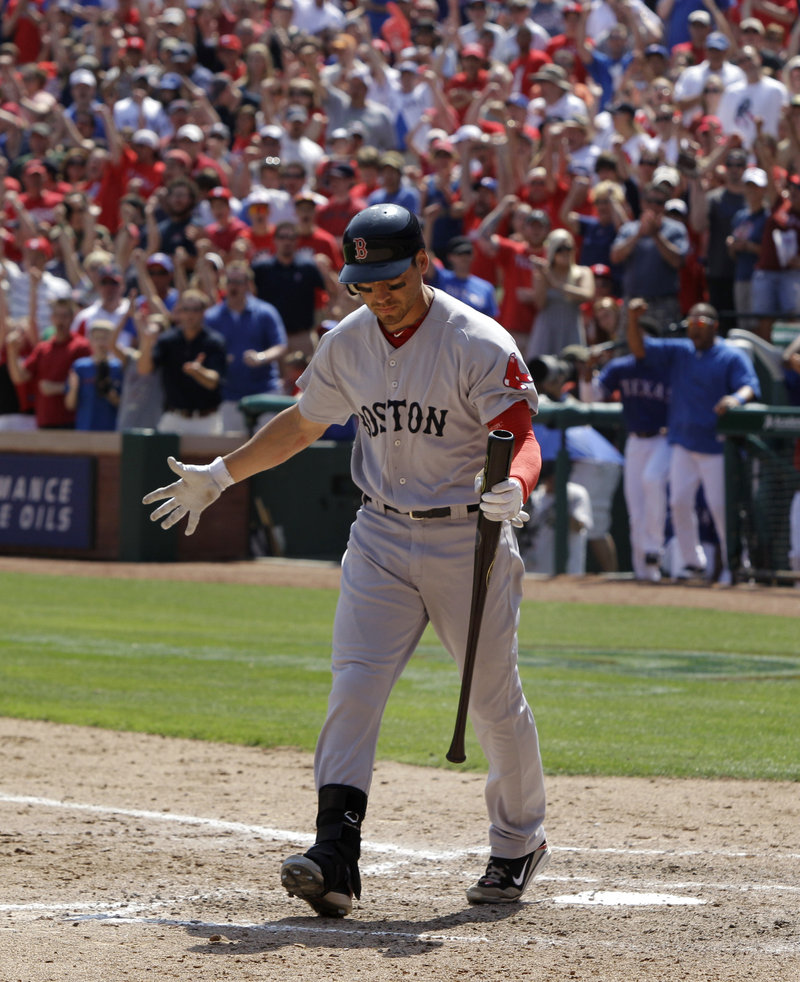 Jacoby Ellsbury reacts after striking out Sunday to leave the bases loaded at the end of the seventh inning against the Rangers in Arlington, Texas. It was that kind of game – and weekend – for Boston.