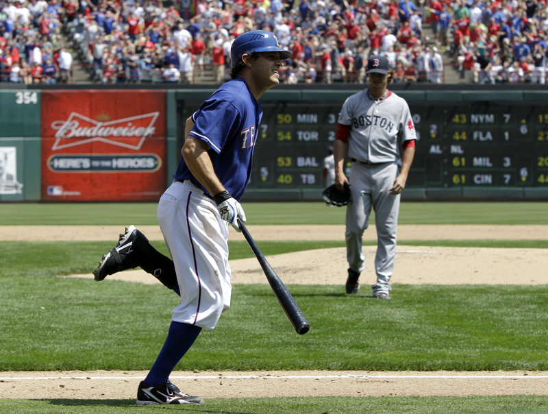 Ian Kinsler of the Texas Rangers strikes again on Sunday, hitting a home run against Clay Buchholz of the Red Sox. Kinsler and Nelson Cruz are the first set of teammates to homer in each of the first three games in a season. The Rangers won, 5-1.