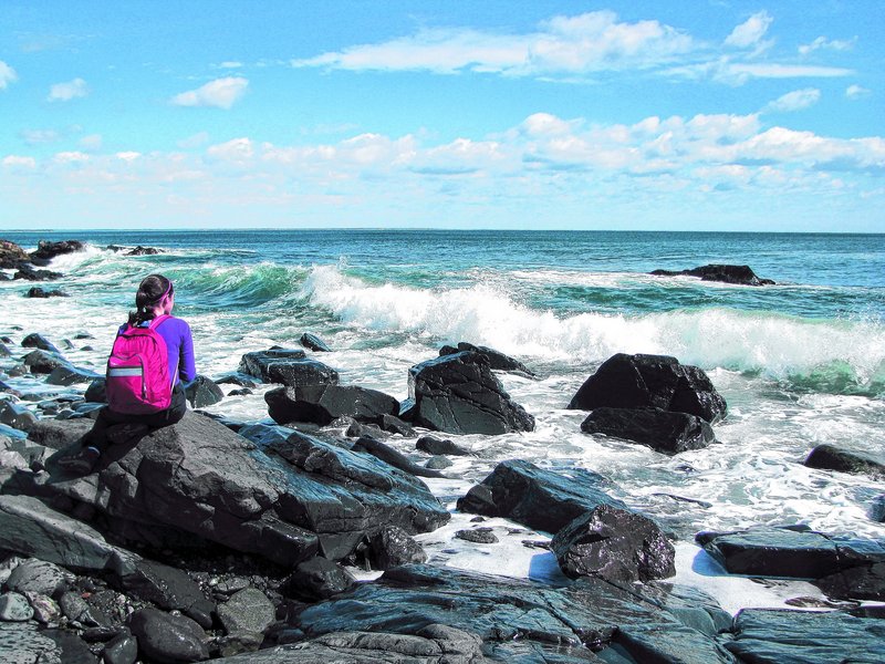 A perch on a seaside rock is one of the pleasures of the Ogunquit trail, but ocean spray often comes along with the view.