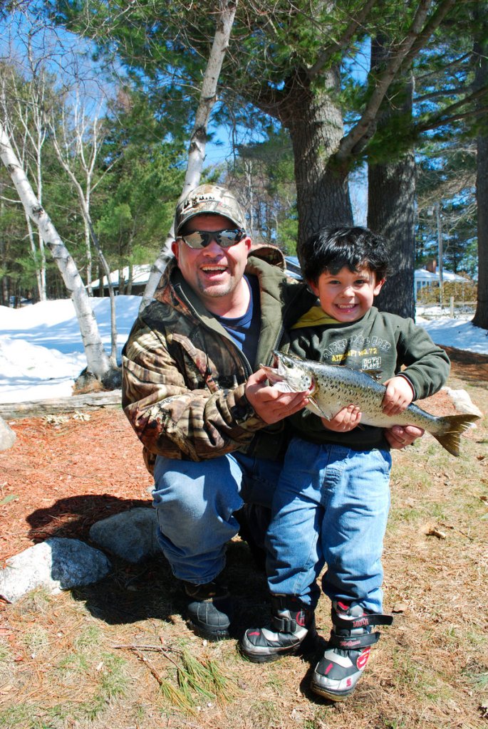 Kurt and Sam Benziger of Wales show their prized salmon caught at Salmon Point on Lake Auburn on April 3. Lake Auburn had just opened for the season, but other nearby waters can be fished all year.