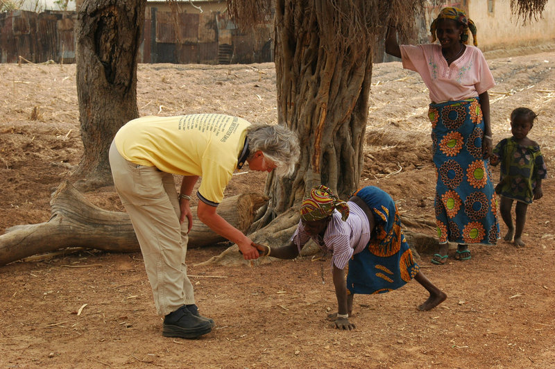 Ann Lee Hussey of South Berwick greets polio victim Uma in the village of Fulani Doka Maijama, Nigeria, in 2008. Surviving polio has given Hussey a link to people she helps overseas through Rotary International.