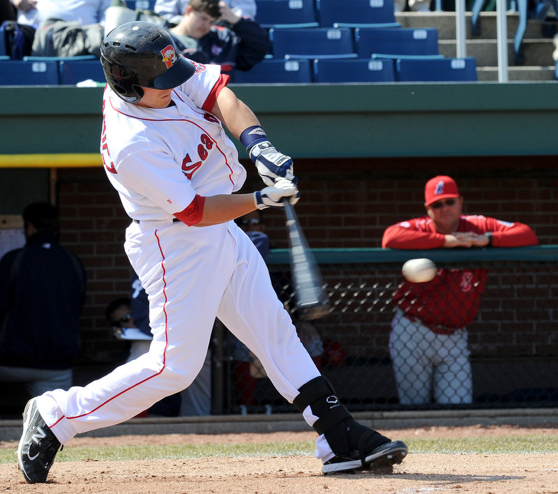Tim Federowicz of the Sea Dogs raps a single Saturday during a 13-5 loss to the Phillies at Hadlock Field. Federowicz had two hits to raise his season average to .500.