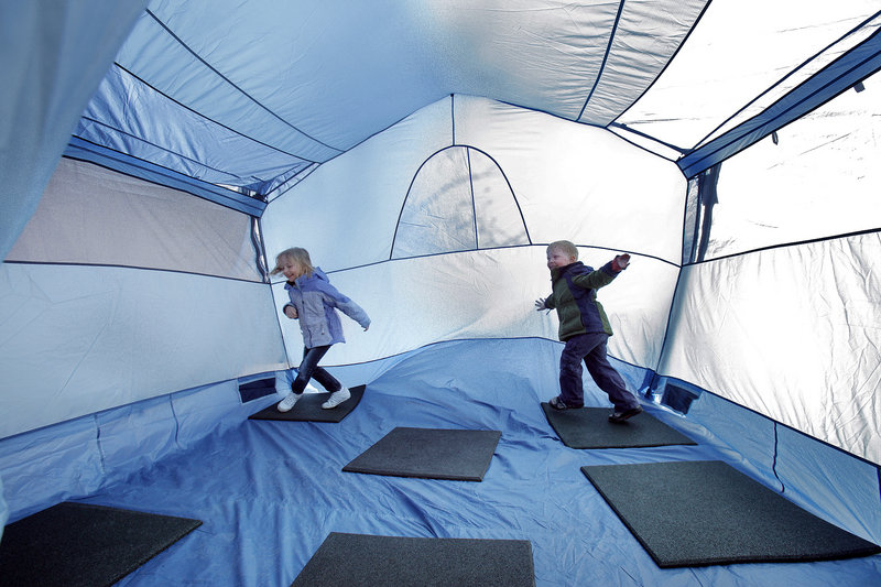 Sarah Dressel, 6, left, and her brother Matt, 3, play in a tent at the Spring Sports Weekend at L.L. Bean in Freeport on Saturday.