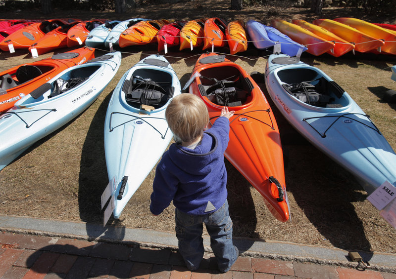 Nineteen-month-old Ethan Yarusavage enjoys the abundance of kayaks.