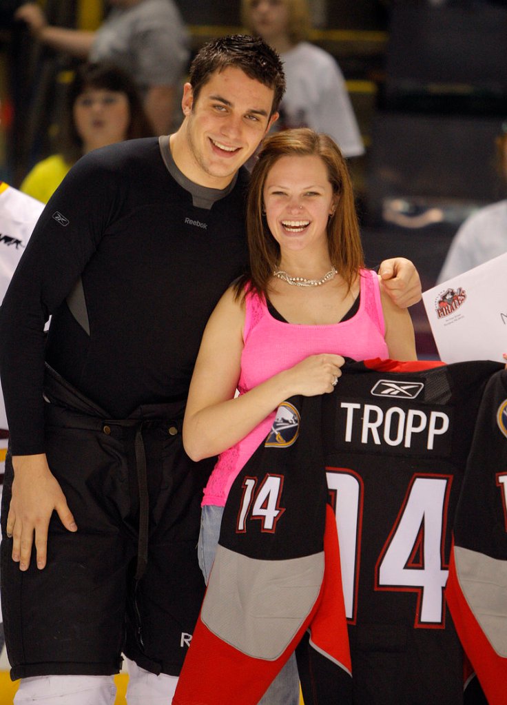 Kari Leighton of Buxton gets her photo taken with Pirates forward Corey Tropp after receiving his jersey Sunday at the Cumberland County Civic Center.