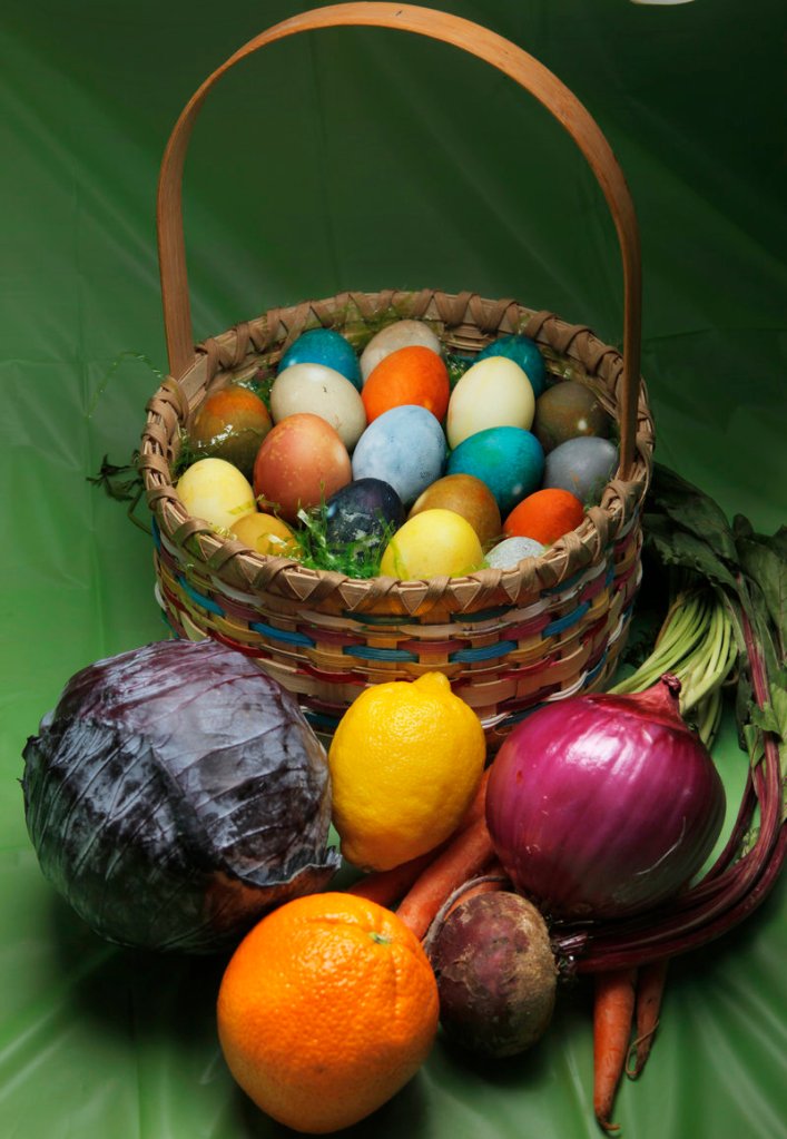 Natural dyes from red cabbage, at left, orange, lemon, beet, red onion skin and carrots – among many other fruits and vegetables and even tea and spices – were used to color the eggs in this Easter basket.