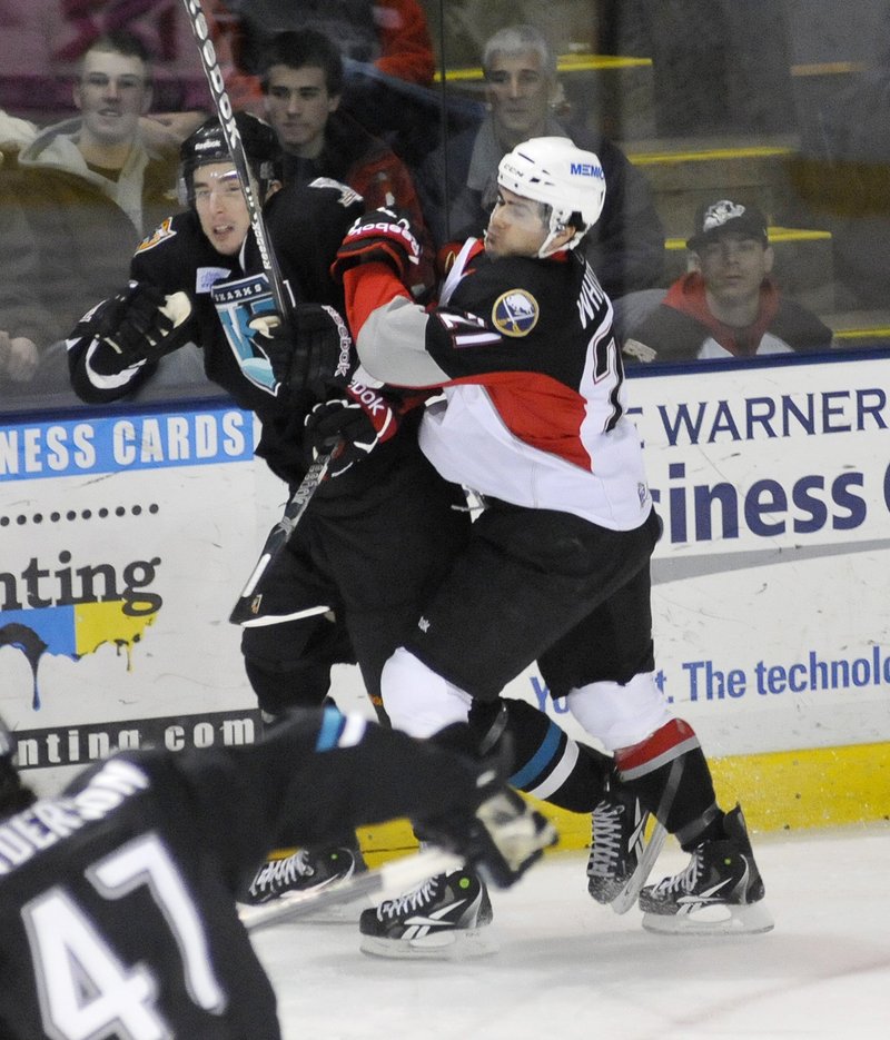 Derek Whitmore, right, has been the constant for the Portland Pirates, not just playing each game but becoming a face of the team in the community.