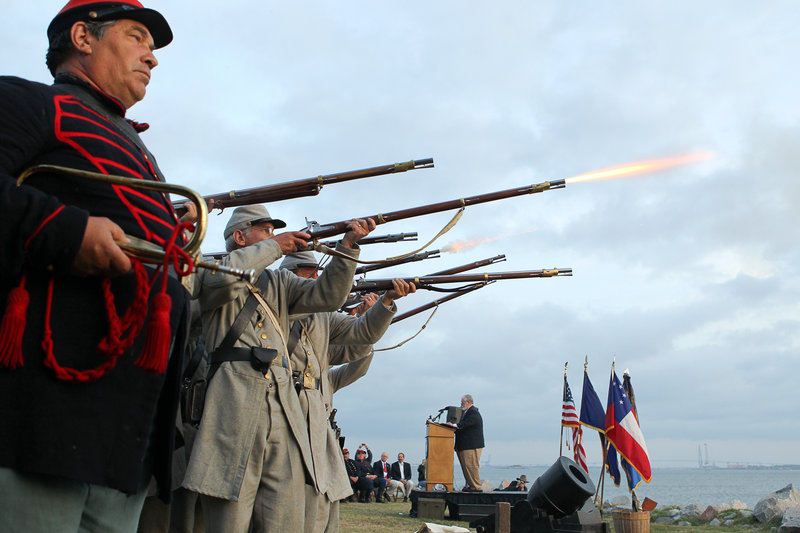 Civil War re-enactors fire a 21-gun salute Tuesday at Fort Johnson, near Fort Sumter, to commemorate the moment the first shots of the Civil War were fired 150 years ago.