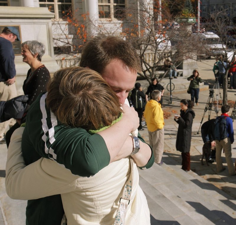 Matt Moonen hugs Taryn Friedman on the steps of Portland City Hall on Nov. 5, 2009, after a failed bid to uphold a gay marriage law.