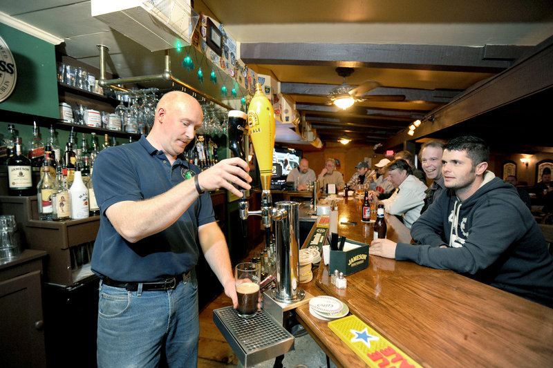 Bartender Tom Shotzberger pours a Guinness at Feile Irish Restaurant and Pub in Wells.