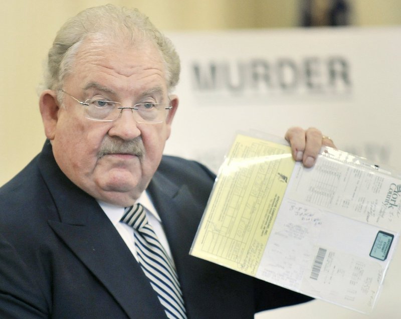 Defense attorney Daniel LIlley holds a piece of evidence as he presents his closing arguments in the murder trial of Jason Twardus last year. Throughout the three-week trial, Lilley suggested that John Durfee, 67, of Alfred was a suspect who had sought to frame his client.