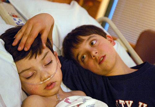 Samuel Habib, 3, comforted by his brother, Isaiah, was back in the hospital after pneumonia and other complications from a tonsilectomy at Dartmouth Hitchcock Medical Center in Lebanon, N.H.
