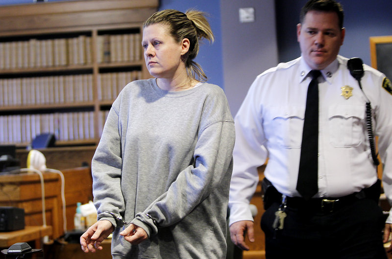 Kristen LaBrie enters the courtroom at her sentencing Friday in Lawrence Superior Court, Lawrence, Mass. Her autistic, cancer-stricken son died at age 9 in 2009.