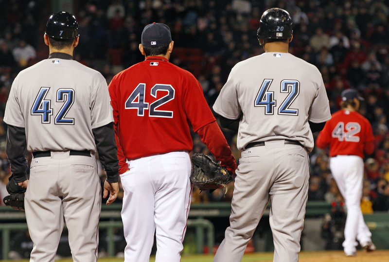 No, it’s not trick photography. Every player and coach wore No. 42 Friday night to honor the 64th anniversary of Jackie Robinson – who wore No. 42 – breaking the color barrier.
