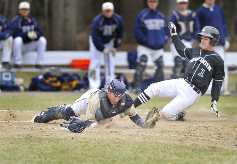Trinity catcher Luke Auger keeps a foot on home plate and holds on to the throw to force Bowdoin’s Adam Marquit during the Polar Bears’ doubleheader sweep Saturday at Brunswick. The Polar Bears won the opener 5-2 and finished the day with an 8-2 victory.