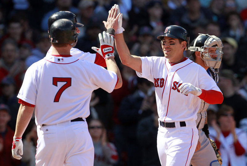 Jacoby Ellsbury, right, is greeted by J.D. Drew, front left, and Jarrod Saltalamacchia after hitting a three-run homer.