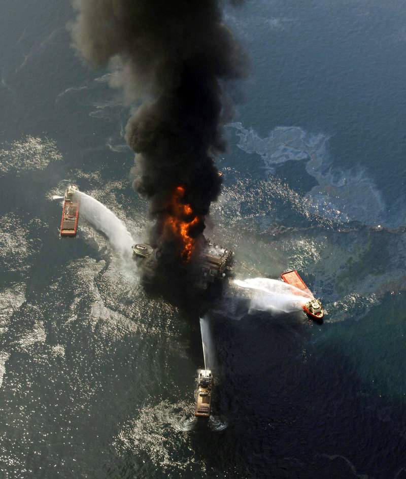 This April 21, 2010, file photo shows the Deepwater Horizon oil rig burning after an explosion in the Gulf of Mexico off Louisiana. BP rented the rig from Switzerland-based Transocean at a cost of $500,000 per day.