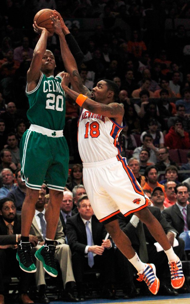 Ray Allen of the Celtics shoots over Roger Mason of the Knicks in the second half Friday night at Madison Square Garden. Allen scored 32 points and hit 8 of 11 3-pointers.