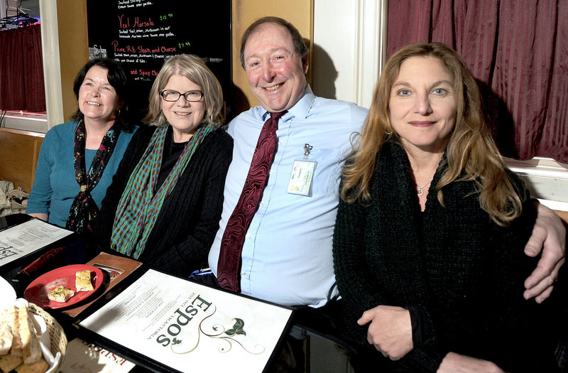 Greg Morin sits with Eileen Delaney, Helen Peake-Godin and Jeanette Andonian at Espo's in Portland on Tuesday. The three women called 911 and did CPR on Morin when he had a heart attack at USM in 2006. "It wasn't my time," said Morin. "I think it was just God's plan."