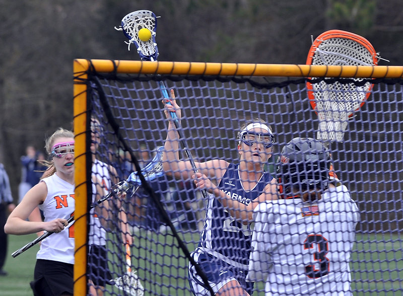 Becca Bell of Yarmouth lines up a shot for one of her seven goals Tuesday during a 16-9 victory against North Yarmouth Academy in girls’ lacrosse. The NYA goalie is Frances Leslie.