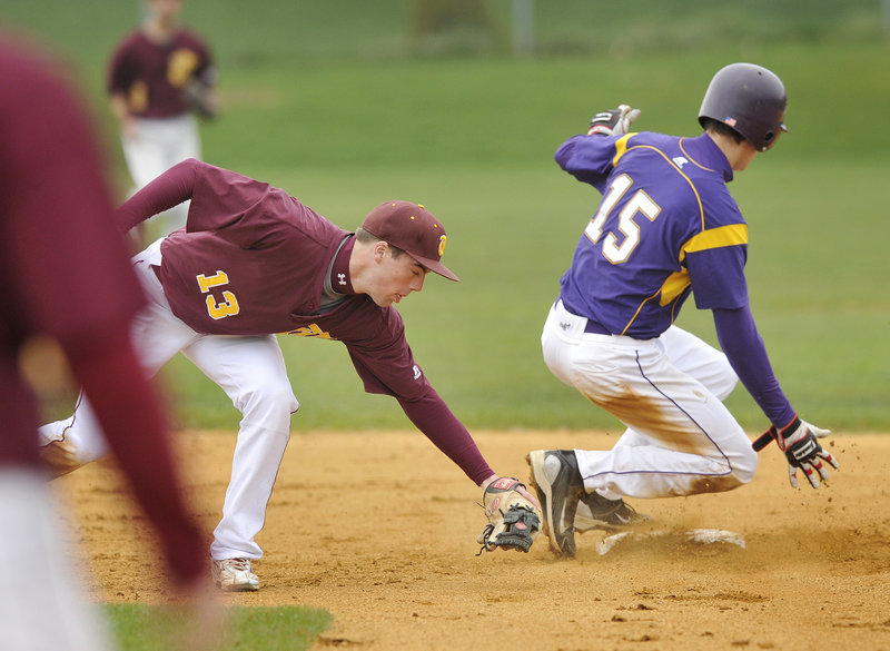 Louis DiStasio of Cheverus beats a tag from Thornton Academy shortstop Sam Canales to steal second base Wednesday in the first inning of Cheverus 5-4 victory at Cheverus High. The Stags are 2-0; Thornton is 1-1.