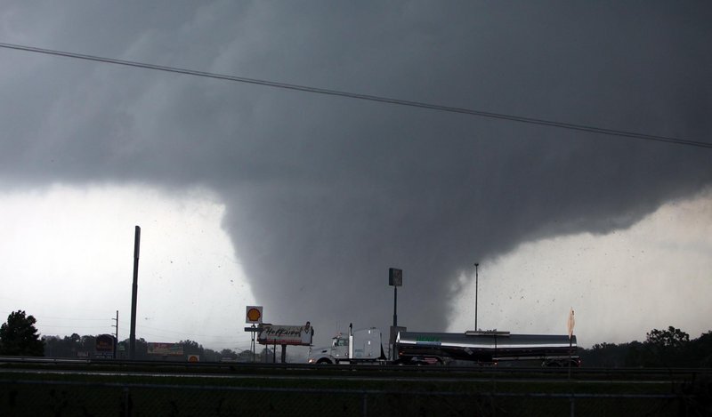 A tornado moves through Tuscaloosa, Ala., on Wednesday. A wave of severe storms laced with tornadoes strafed the South, with dozens killed and injured.