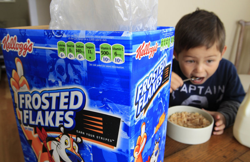 Four-year-old Nathaniel Donaker eats Kellogg’s Frosted Flakes in Palo Alto, Calif. Commercials promoting sugary breakfast cereals could fall under government guidelines urging food companies to limit marketing of unhealthy products to children.
