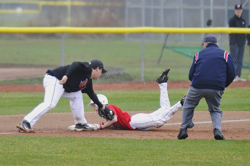Will Bushey of South Portland slides safely into third base with a triple Thursday as Nate McKeown of Biddeford applies the late tag during South Portland’s 11-1 victory in a Telegram League baseball game at home. Each team has a 2-1 record.