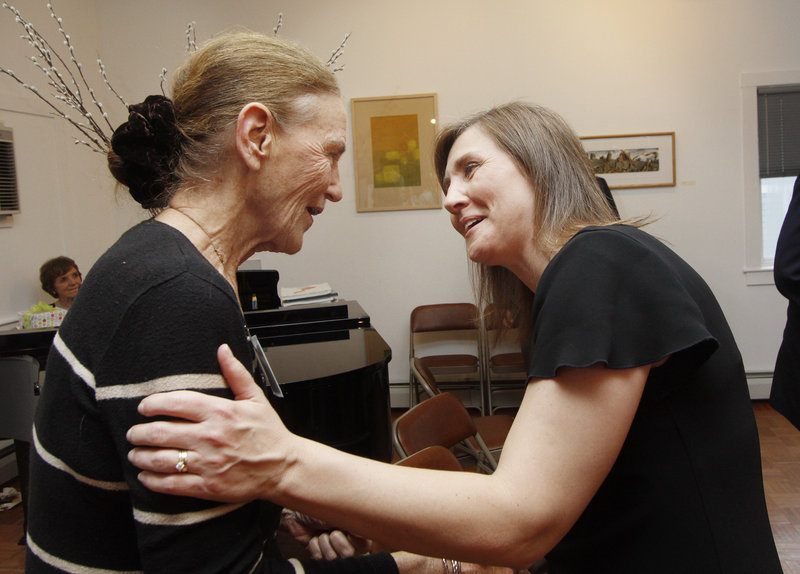 Denise Wilson, right, of Counseling Services Inc. congratulates Millicent Monks after Monks was honored for speaking out about mental illness.