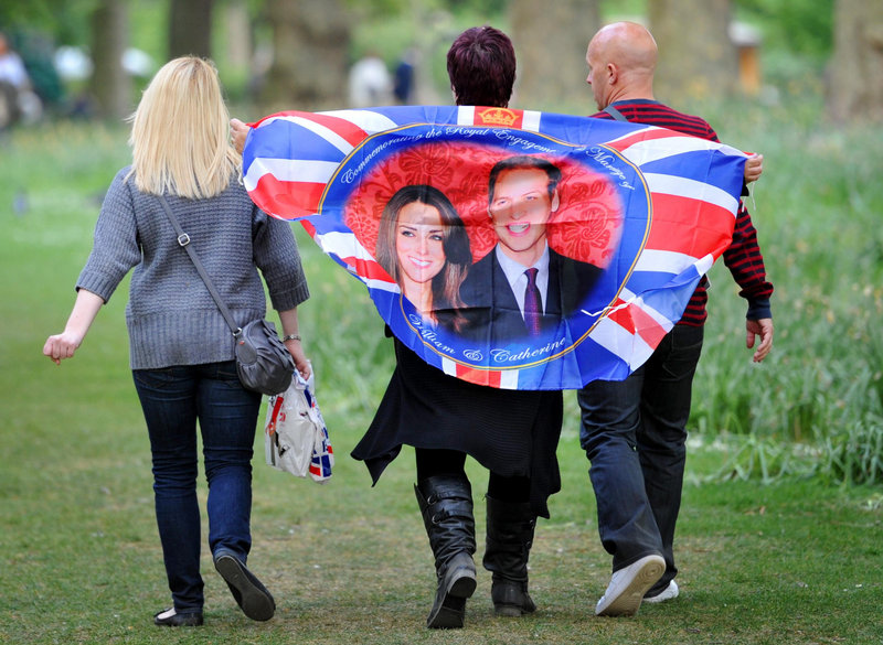 In St. James’s Park, the oldest of London’s royal parks, people carry reminders Thursday of today’s wedding of Prince William and Kate Middleton.