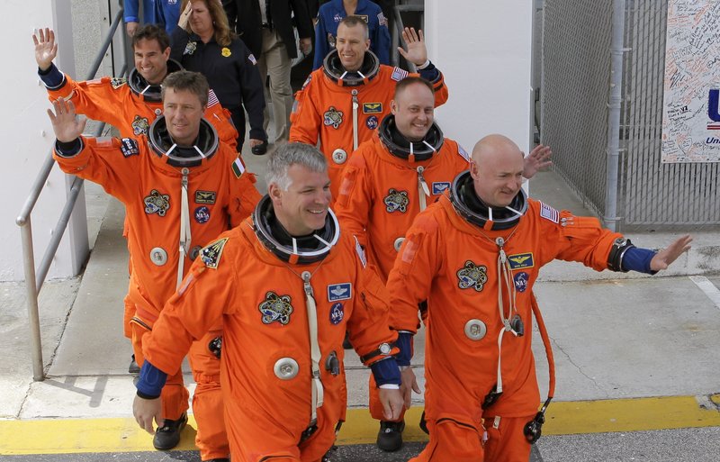 The crew of space shuttle Endeavour, seen Friday boarding at Kennedy Space Center in Cape Canaveral, Florida, includes mission commander Mark Kelly, right. Kelly is the husband of Sen. Gabrielle Giffords, who is recovering from a gunshot wound but made the trip from a Houston hospital. The launch, however, was eventually scrubbed because of technical problems. The historic mission is the last for the Endeavour shuttle, and the next-to-last for the shuttle program.