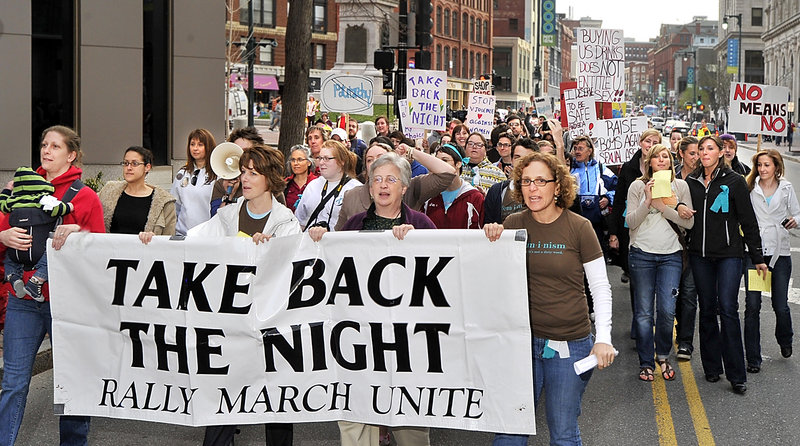 A chanting throng marches down Congress Street from Monument Square following Friday’s 30th annual Take Back the Night rally in support of survivors of sexual violence.