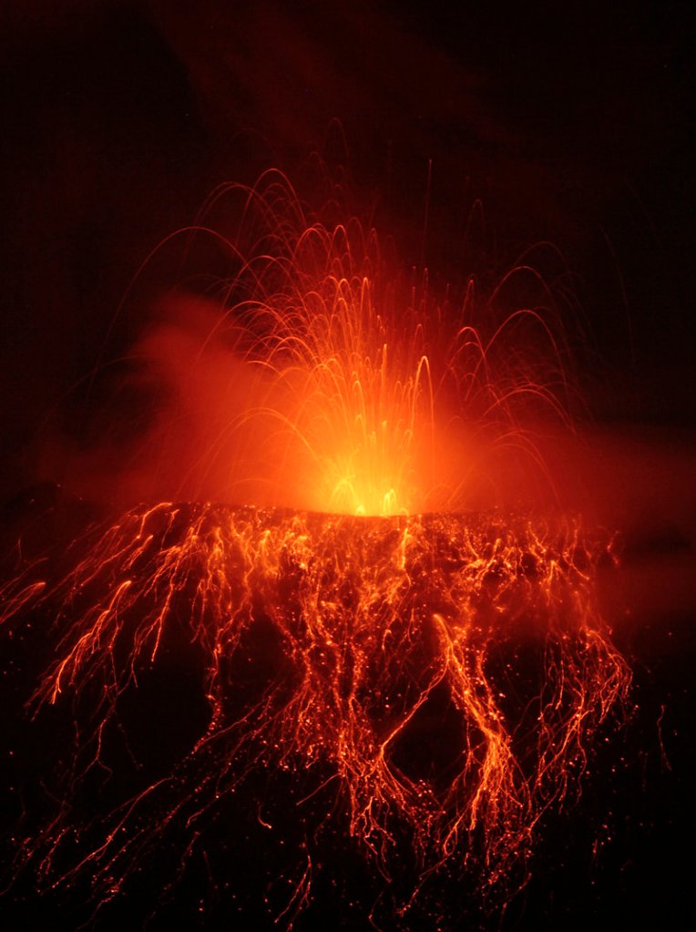 The Tungurahua volcano spews ash and stones during an eruption viewed from Cotalo, Ecuador, on Friday. The volcano has been active since 1999.
