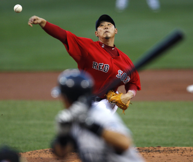 Daisuke Matsuzaka struck out four and allowed three hits and four walks before leaving in the fifth inning with tightness in his right elbow Friday night at Fenway Park.