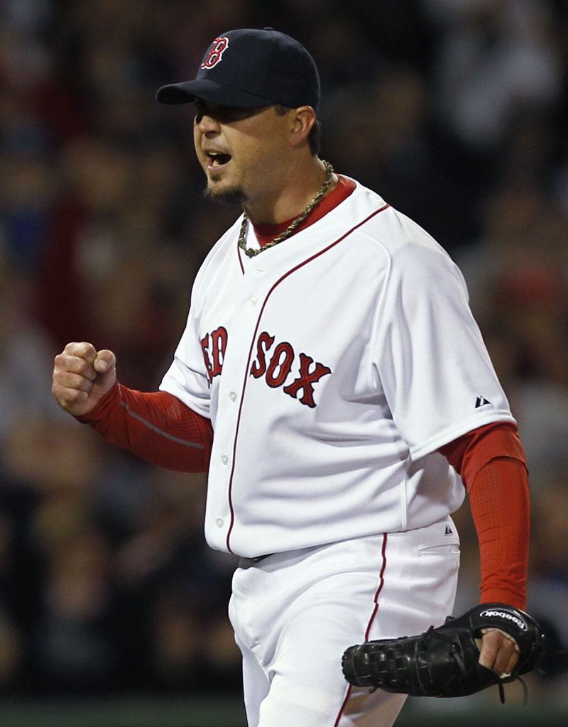 Boston pitcher Josh Beckett pumps his fist after the Red Sox turned a double play against the New York Yankees during the third inning Sunday night at Fenway Park in Boston.