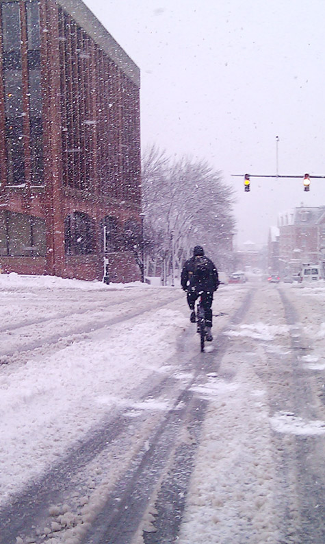 A bicyclist on Temple Street cautiously approaches the intersection at Middle Street this morning. Cellphone photo.
