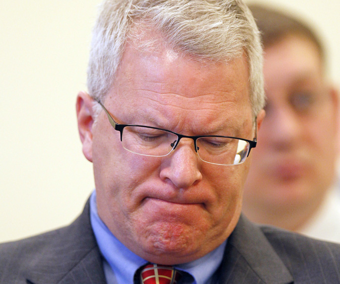 Paul Violette, former executive director of the Maine Turnpike Authority, grimaces before appearing before the Legislature's Government Oversight Committee today.