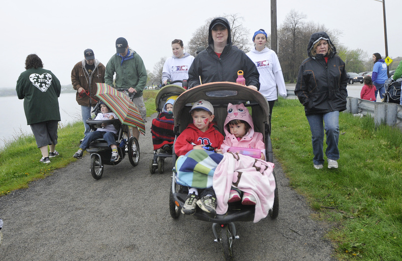 Gabby Petruccelli pushes her children Nicholas, 5, and Jillian, 3, in a walker as she walks in the American Heart Association Southern Maine heart walk today. Putruccelli who lives in Portland is an Occupational Therapist with Maine Medical Center's Rehabilitation Department.