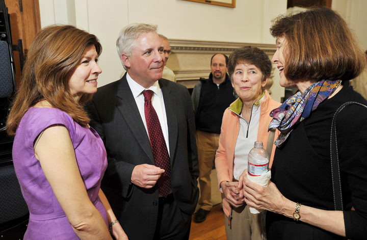 Beth and Mark Rees, on left, talk with Sally Oldham and Hilary Bassett from Greater Portland Landmarks at a reception last Friday in the State of Maine Room at Portland City Hall.