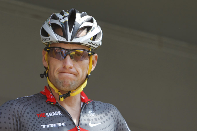 Lance Armstrong grimaces prior to the start of the third stage of the Tour de France cycling race in Wanze, Belgium, in this July 6, 2010, photo.