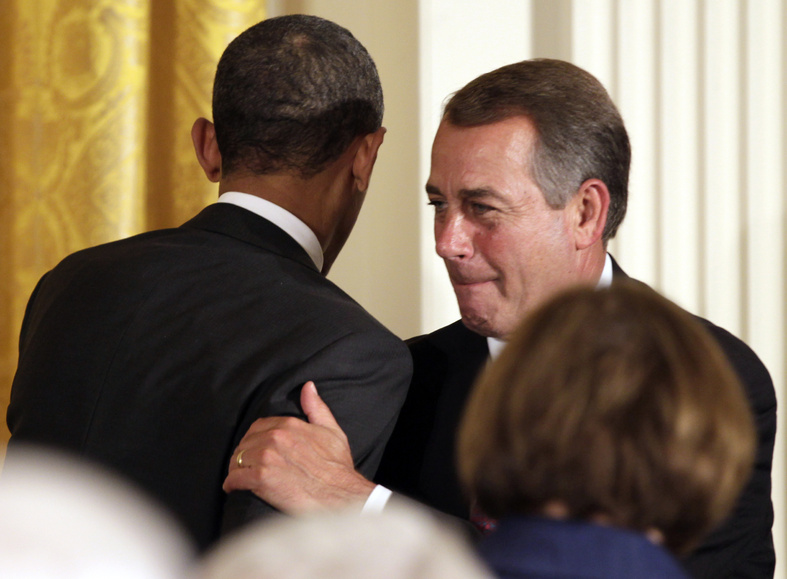 President Obama, right, is greeted by House Speaker John Boehner, R-Ohio, as he arrives to speak during a dinner for a bipartisan group of congressional leaders and ranking members and their spouses at the White House on Monday. “Last night’s news unified our country” much as the terrorist attacks of 2001 did, Boehner said earlier in the day.